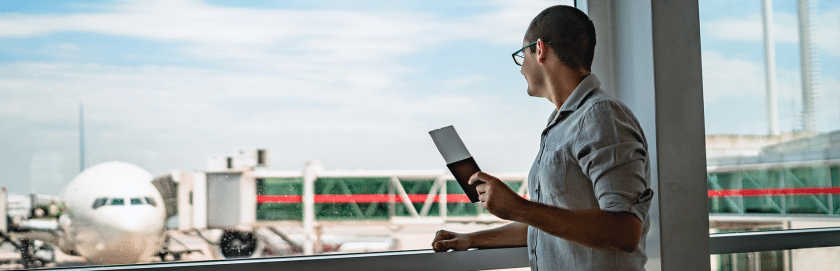 man-about-to-board-plan-with-ticket-passport