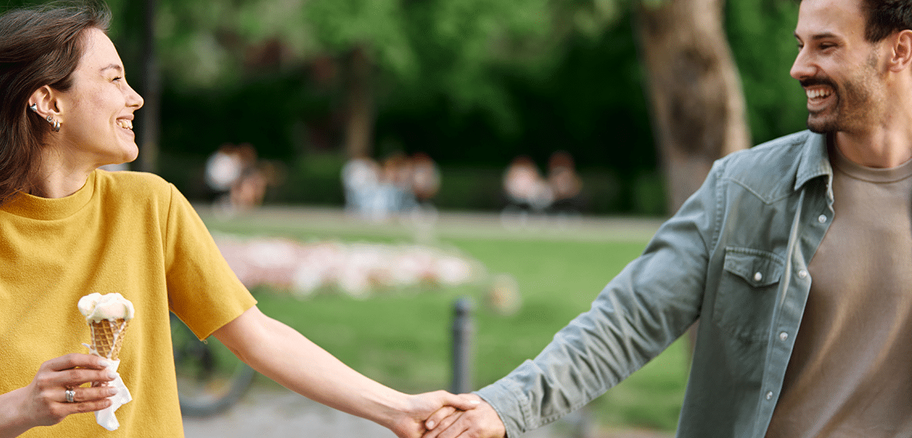 healthy happy couple park walk with ice cream