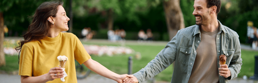 healthy happy couple park walk with ice cream
