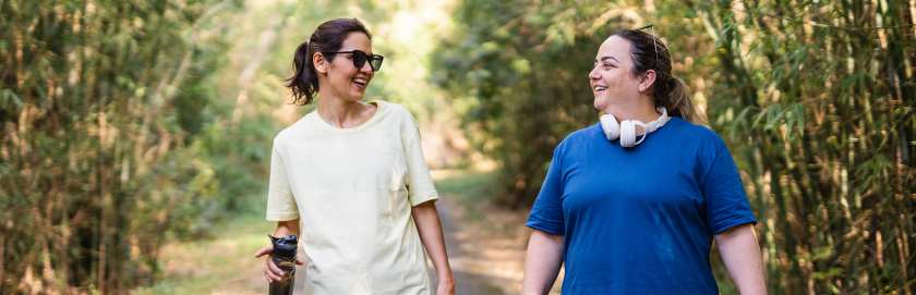 Manage Burnout - 2 women mindful walk in park