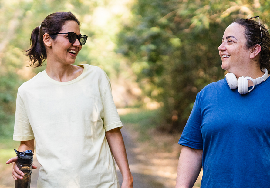 Manage Burnout - 2 women mindful walk in park