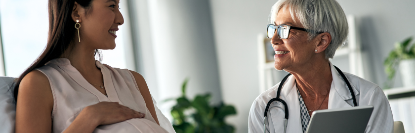 pregnant woman seeks medical advice smiling