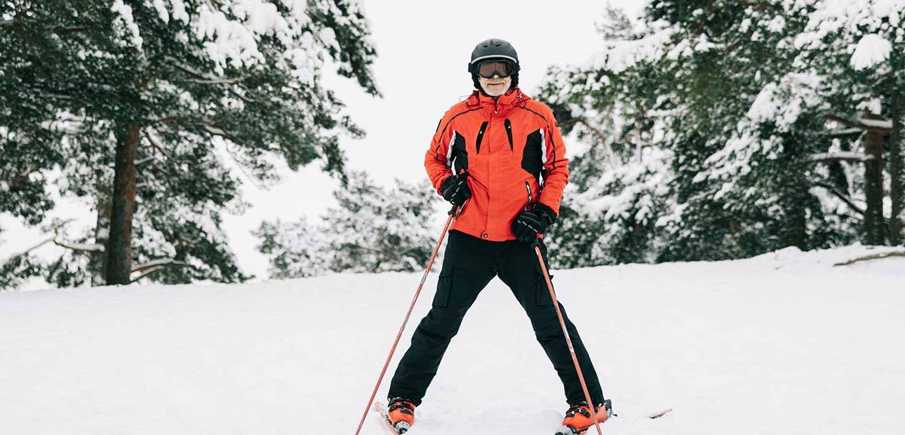 senior man happy skiing