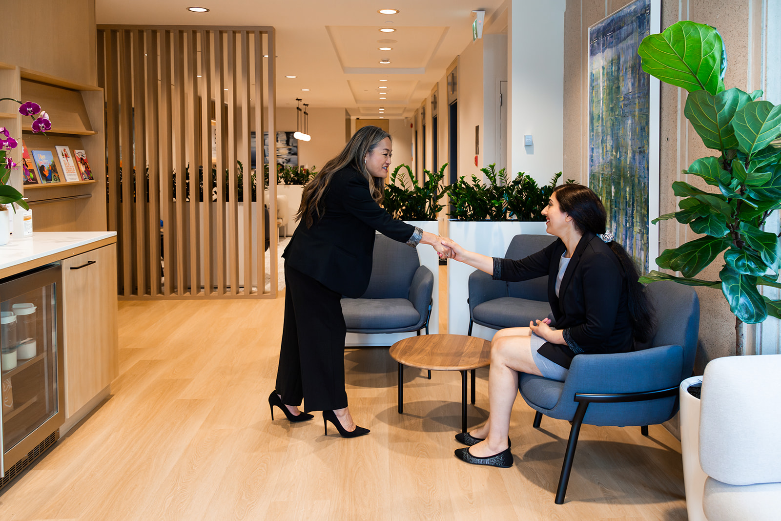 Greeting patient in waiting room with smile