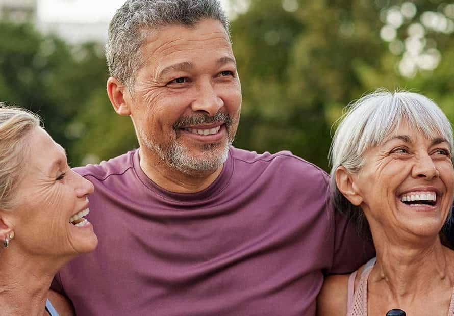 2-women-2-men-smiling-outside-exercise