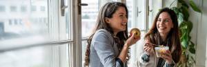 Eating in Sync with Your Cycle: The Follicular and Ovulatory Phases 3 2 women smiling eating healthy food