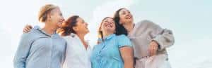 Menopause webinar April 2026_blog header_4 women friends sun smile