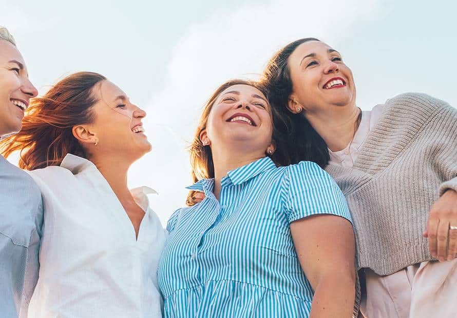 Menopause webinar April 2026_blog header_4 women friends sun smile