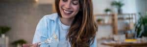 Supporting Your Menstrual Cycle Through Nutrition 2 smiling woman eating salad