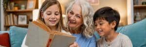 Grandmother reading with grandchildren